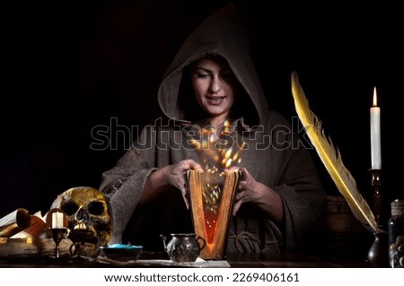 Sorceress with magic book and fairy dust