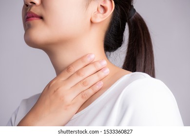 Sore Throat. Closeup Of Beautiful Young Woman Hand Touching Her Ill Neck. Healthcare and medical concept. - Powered by Shutterstock