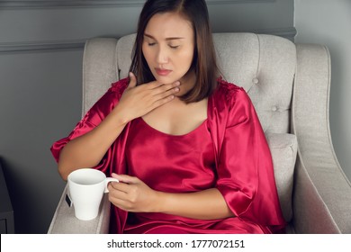 A Sore Throat Is A Pain, Scratchiness, Or Irritation, Asian Women In Red Silk Nightwear With Acid Reflux At Night, The Concept Of Healthcare And Medicine.