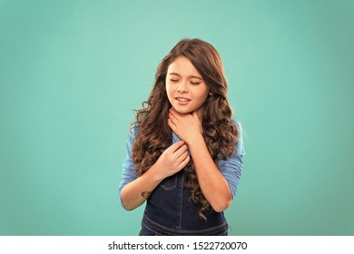 Sore Throat Remedies. Kid Feels Pain In Throat. Girl Cute Kid Suffer From Pain In Neck. Girl Painful Face Stand Blue Background. Health Care And Medicine. Sore Throat Remedies. Throat Pain Treatment.