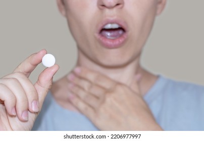 Sore Throat And Runny Nose Treatment. Woman Using Lozenge Candy Spray For Red Painful Throat Or Nose Sprayer Isolated.girl Coughing Hold Hand On Neck Or Mouth.feeling Pain,respiratory Virus Infection