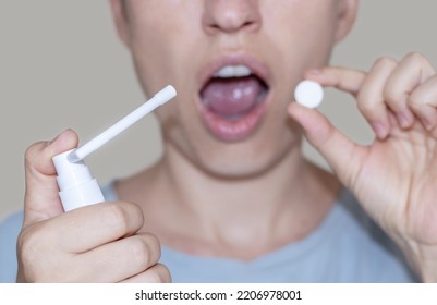 Sore Throat And Runny Nose Treatment. Woman Using Lozenge Candy Spray For Red Painful Throat Or Nose Sprayer Isolated.girl Coughing Hold Hand On Neck Or Mouth.feeling Pain,respiratory Virus Infection