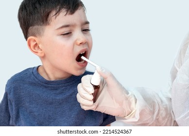 Sore Throat Treatment Concept.cute Baby Boy Preschooler Kid Using Honey Lemon Ingredients Spray For Red Neck Pain.doctor Medical Assistant Hand In Surgical White Glove.smiling Child Home Isolated Mock