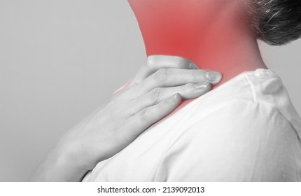 Sore Throat. Woman Hand Holding Painful Neck With Red Point Closeup. From. Health Care, Medicine, Illness Concept. Flu, Cold, Inflammation. Black And White. High Quality Photo