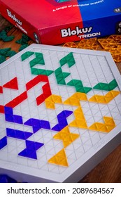 Sorel-Tracy, Canada - December 12 - 2021: View Of Blokus Trigon Strategy Board Game On Wood Plank Table.n Abstract Strategy Game From The Makers Of Blokus. 