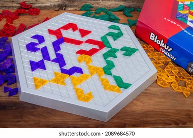 Sorel-Tracy, Canada - December 12 - 2021: View Of Blokus Trigon Strategy Board Game On Wood Plank Table.n Abstract Strategy Game From The Makers Of Blokus. 