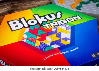 Sorel-Tracy, Canada - December 12 - 2021: View Of Blokus Trigon Strategy Board Game On Wood Plank Table.n Abstract Strategy Game From The Makers Of Blokus. 