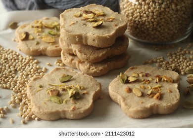Sorghum ghee cookies. Ghee cookies with sorghum flour garnished with pistachios. Commonly called Nankhatai. A shortbread biscuits originating from the Indian subcontinent, popular in Northern India.