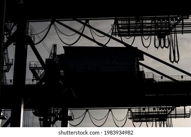 Sorong, West Papua, Indonesia, May 31st 2021. The silhouette of Quay Gantry Crane (QC). The counter weight beam of  Ship to Shore Crane  (STS) at  yard of Sorong harbor.