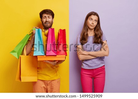 Similar – Yellow shopping bags on a blue background, Shopping concept