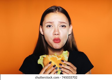 Sorry Girl Has A Burger On An Orange Background