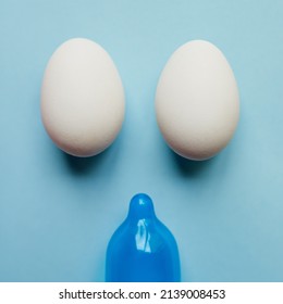 Sorry Guys Its Not Happening Today. Studio Shot Of A Blue Condom And Two Eggs Placed Against A Blue Background.