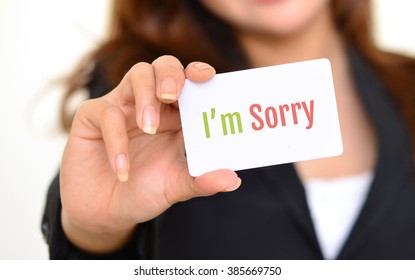 I'm Sorry, Motivate Message On The Card Shown By A Business Woman,