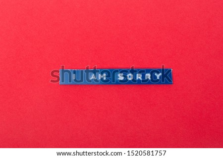 I am Sorry printed with a labelprinter on a red Cardboard