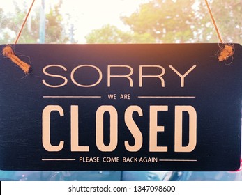 Sorry We Are Closed Please Come Back Again Label On Shop Door