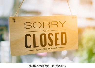 Sorry We Are Closed Sign Hang On Door At Coffee Shop.