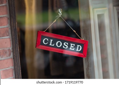 sorry we are closed sign hanging outside a restaurant, store, office or other - Shutterstock ID 1719119770
