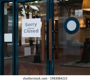 sorry we are closed sign hanging outside a restaurant, store, office or other - Shutterstock ID 1983084215