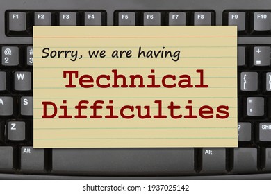 Sorry We Are Having Technical Difficulties Message On A Black Keyboard 