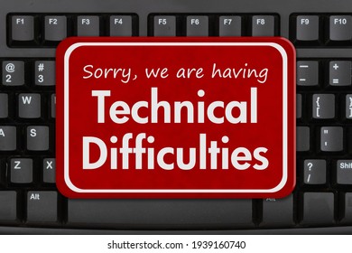 Sorry We Are Having Technical Difficulties Message On A Black Keyboard 