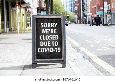 Sorry we're CLOSED due to COVID-19. Foldable advertising poster on the street - Shutterstock ID 1676781646