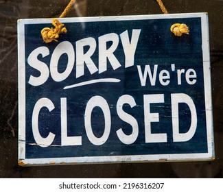 Sorry Were Closed sign in a window. - Shutterstock ID 2196316207