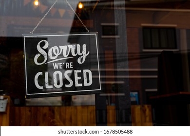 Sorry we're closed . vintage black and white retro sign on a coffee glass door - Shutterstock ID 1678505488