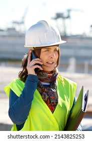 Sorting Out The Construction Needs. A Female Construction Worker Talking On The Phone.