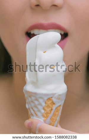 Sorvete, Ice cream. Picture of a woman eating ice cream in waffle cone.
