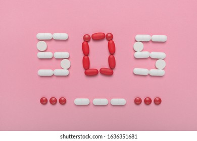 SOS Morse Code With Medical Drugs And Pills, Top View Flat Lay Conceptual Image For Addiction And Overuse Of Medication