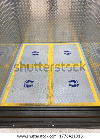 Sosial distancing floor guide inside an elevator.