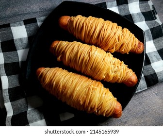 Sosis Gulung Mie Or Sausage Roll Noodles Served On Black Plate