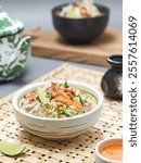 Soto Pacitan, a kind of soup, is one type of soto from Indonesia. Clear broth with spices served with hot white rice or vermicelli, celery, bean sprouts, shredded chicken, sambal, and fried peanuts.