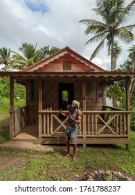 Soufriere / Saint Lucia - December 3, 2015: An Old Man Stands In Front Of A Replica Period House On The Tet Paul Nature Trail