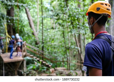 Soufriere, St. Lucia - December 31, 2015: An Attendant On A Platform At A Zipline Attraction In St. Lucia.