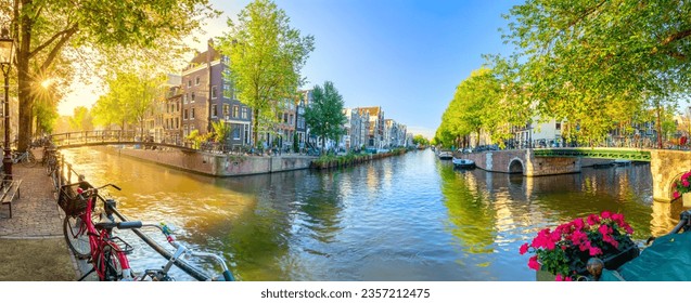Soul of Amsterdam. Early morning in Amsterdam. Ancient houses, bridges, traditional bicycles, canals, boats. Panoramic view with all the sights of Amsterdam. Holland, Netherlands, Europe. - Powered by Shutterstock