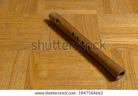 Sound body, light brown wooden flute, music instrument, wind instrument, flute, woodwind instrument
