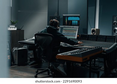 Sound engineer used digital audio mixer Sliders Engineer presses key Control panel Recording studio technician - Powered by Shutterstock