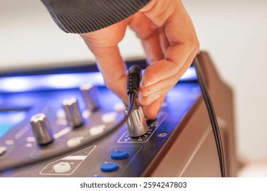 Sound engineer using digital audio mixer sliders Engineer pressing keys adds control panel volume Recording studio technician close up. High quality photo