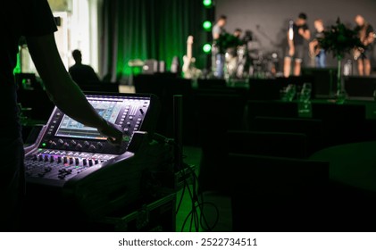 Sound engineer working backstage while preparing audio equipment for a live concert