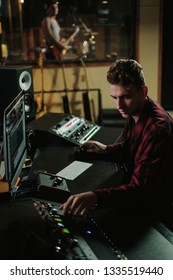 Sound Engineer Working In A Music Studio