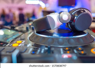 Sound equipment. Headphones on a DJ console. Equipment for organizing quizzes. Sale of professional headphones. Work with sound. Music Festival. Party Work by DJ. Acoustic system in the club.