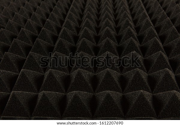 Sound proof Acoustic black gray foam absorbing,\
pyramid style padding layer panel for voice recording studio attach\
on wall as wallpaper background to reduce and protect sound to\
outside room