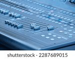 A sound recording studio mixing desk. Music mixer control panel. Closeup. Selective focus.