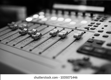 Sound Recording Studio Mixing Desk. Music Mixer Control Panel. Closeup. Selective Focus. Black And White Image