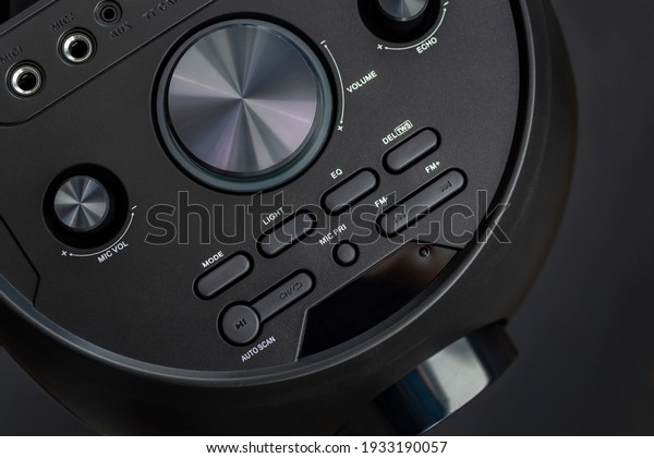 sound\
speakers.black music subwoofer, volume control more and less. aux,\
mic vol, play, stop, fm. horizontal photo. flat\
lay