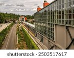 SOUND TRANSIT LIGHT RAIL STATION ON MERCER ISLAND SHOWING THE TWO STATIONS AND RAILS ALONG THE I-90 FREEWAY WITH A NICE SKY IN KING COUNTY WASHINGTON