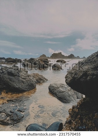 Similar – Image, Stock Photo Beach with rocks and puddle in a sunset, ribadeo, lugo, galician, spain