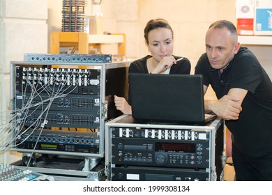 Sound Worker On A Mixer Board