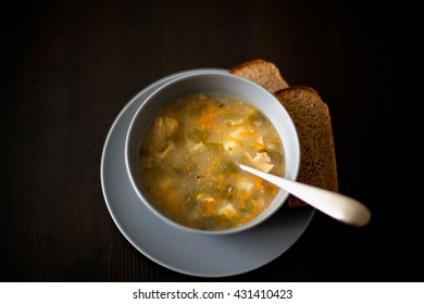 soup with bread, selective focus 
